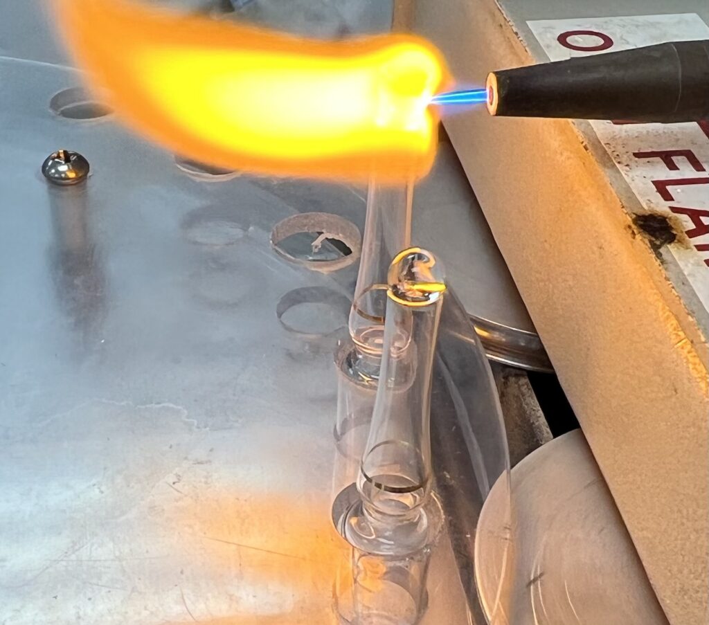 picture of an ampule being sealed with flame